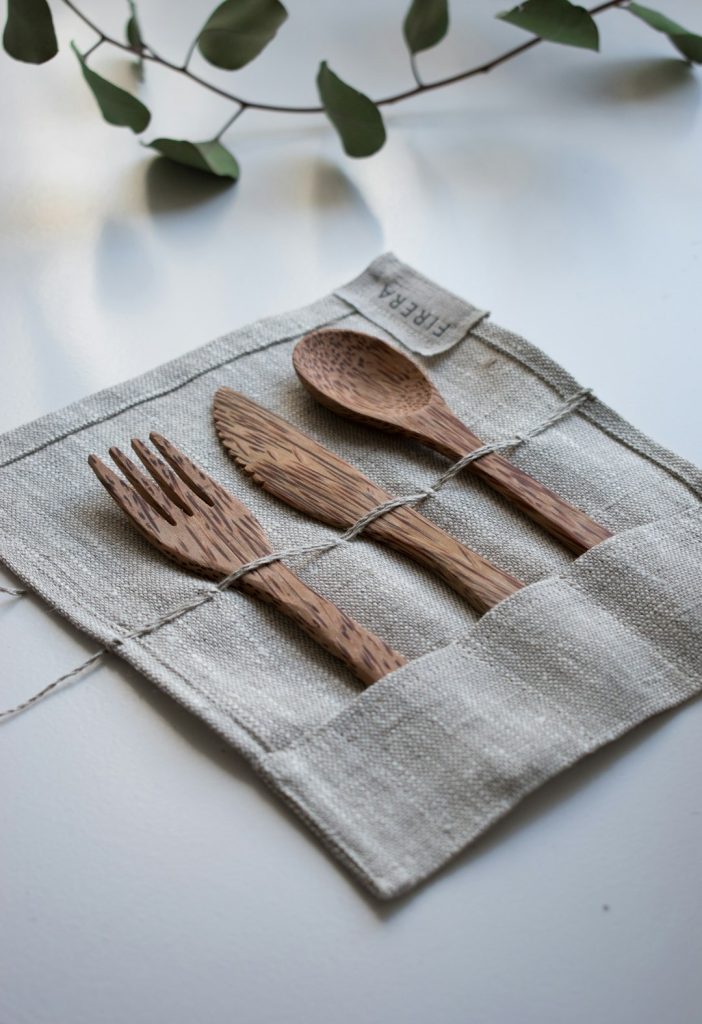 brown-wooden-fork-spoon-and-knife-on-textile-xxryh-ybxds